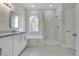 Elegant bathroom featuring white cabinets, granite countertop, separate shower and tub at 7900 Saint Giles Pl, Orlando, FL 32835