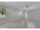 Spacious bedroom with tile flooring, neutral paint, and ample natural light from multiple windows at 7900 Saint Giles Pl, Orlando, FL 32835