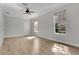 Bright bedroom featuring hardwood floors, natural light and a ceiling fan at 7900 Saint Giles Pl, Orlando, FL 32835