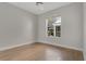 Bedroom with bamboo floors and a window offering natural light and outdoor views at 7900 Saint Giles Pl, Orlando, FL 32835