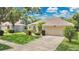 Attractive single-Gathering home with a well-kept lawn and attached two-car garage at 7900 Saint Giles Pl, Orlando, FL 32835
