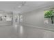 Bright and airy living room with tile flooring and multiple windows providing natural light at 7900 Saint Giles Pl, Orlando, FL 32835