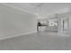 Open-concept living area featuring tile flooring, neutral walls, and seamless flow to the kitchen at 7900 Saint Giles Pl, Orlando, FL 32835