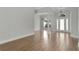 Bright and airy living room with wood floors, white trim and abundant natural light at 7900 Saint Giles Pl, Orlando, FL 32835
