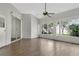 Sun-drenched room with large windows offering views of the landscaped backyard at 7900 Saint Giles Pl, Orlando, FL 32835
