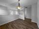 Dining room featuring wood floors, overhead lighting, and bright walls at 84 Camino Real Blvd, Howey In The Hills, FL 34737