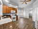 Kitchen featuring granite counters, a range, a window, and wood-colored cabinets at 84 Camino Real Blvd, Howey In The Hills, FL 34737