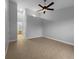 Large main bedroom featuring high ceilings, tile floors, and an ensuite bathroom at 84 Camino Real Blvd, Howey In The Hills, FL 34737
