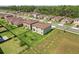 A neighborhood aerial showing houses, yards, and the surrounding landscape at 850 Lazio Cir, Debary, FL 32713