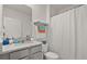 Bathroom featuring white walls, tile flooring, a shower with a white curtain and a vanity at 850 Lazio Cir, Debary, FL 32713