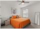 Bedroom featuring white walls, carpet flooring, ceiling fan, window with curtains, and a gray bed frame at 850 Lazio Cir, Debary, FL 32713