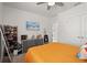 Well-lit bedroom with decoratives and a TV set up on the wall at 850 Lazio Cir, Debary, FL 32713