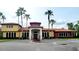 Beautiful clubhouse with a red tile roof, fountain, and palm trees at 850 Lazio Cir, Debary, FL 32713