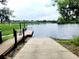 A community boat ramp and dock leads to beautiful lake views at 850 Lazio Cir, Debary, FL 32713