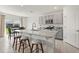 Modern kitchen featuring a large island, granite countertops, and stainless steel appliances at 850 Lazio Cir, Debary, FL 32713