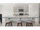 Stylish kitchen island with granite countertops, seating, and modern fixtures at 850 Lazio Cir, Debary, FL 32713