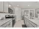 Well-equipped kitchen with granite countertops, stainless steel appliances, and ample cabinet space at 850 Lazio Cir, Debary, FL 32713