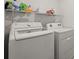 Laundry room featuring white walls, wire shelf with supplies, and white washer and dryer at 850 Lazio Cir, Debary, FL 32713