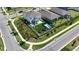 Aerial view of home with fenced backyard, pool, artificial turf, and outdoor amenities at 9027 Coral Cape St, Kissimmee, FL 34747