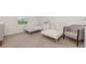 Shared bedroom with two twin beds and neutral decor at 9027 Coral Cape St, Kissimmee, FL 34747