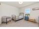 Cozy bedroom with natural light from the window at 9027 Coral Cape St, Kissimmee, FL 34747