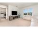 Comfortable bonus room with entertainment center and a washing machine on the side at 9027 Coral Cape St, Kissimmee, FL 34747