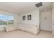 Upstairs bonus room featuring a large sectional sofa and a window at 9027 Coral Cape St, Kissimmee, FL 34747
