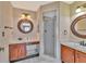 Updated bathroom featuring double vanities and a glass-enclosed shower at 935 Northern Dancer Way # 107, Casselberry, FL 32707
