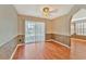 Eat in kitchen area has hardwood floors, modern lighting, and sliding doors to the patio at 935 Northern Dancer Way # 107, Casselberry, FL 32707
