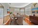 Formal dining room is illuminated by natural light and designer accents at 935 Northern Dancer Way # 107, Casselberry, FL 32707