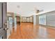 Open living area boasts hardwood floors, large windows and open floor plan at 935 Northern Dancer Way # 107, Casselberry, FL 32707