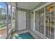 This is a nice screened-in patio with tile flooring and access to both a storage closet and the interior via sliding glass doors at 935 Northern Dancer Way # 107, Casselberry, FL 32707