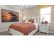 Cozy bedroom with floral wallpaper, a plush bed, and ample natural light at 944 Club Cresswind Dr, Lady Lake, FL 32159