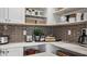 Convenient kitchen nook with tile backsplash and open shelving at 944 Club Cresswind Dr, Lady Lake, FL 32159