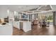 Spacious open-concept kitchen featuring a large island, stainless appliances, and seamless flow to living and dining areas at 944 Club Cresswind Dr, Lady Lake, FL 32159