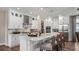 Bright kitchen boasts a large marble island with seating, stainless steel appliances, and an adjacent walk-in pantry at 944 Club Cresswind Dr, Lady Lake, FL 32159