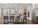 This kitchen boasts an island with seating, modern stainless appliances, and a walk-in pantry at 944 Club Cresswind Dr, Lady Lake, FL 32159