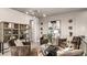 A cozy living room with plush seating, stylish decor, and a unique display cabinet at 944 Club Cresswind Dr, Lady Lake, FL 32159