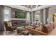 A modern living room with a fireplace, stylish seating, and elegant decor at 944 Club Cresswind Dr, Lady Lake, FL 32159
