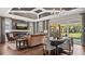 Open living space with a fireplace, stylish furniture, and a view to the outdoors at 944 Club Cresswind Dr, Lady Lake, FL 32159