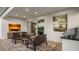 Covered patio with comfortable seating, grill, and view of interior dining room at 944 Club Cresswind Dr, Lady Lake, FL 32159