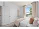 Bright bedroom with large windows, soft natural light, and neutral decor at 10148 Hadley St, Orlando, FL 32829