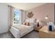 This bedroom features natural light and neutral tones, creating a calm and inviting space at 10148 Hadley St, Orlando, FL 32829