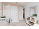 This stylish bedroom includes a crib and lots of functional storage at 10148 Hadley St, Orlando, FL 32829
