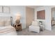 Comfortable main bedroom with elegant décor, soft lighting, and a cozy chair with a plant at 10148 Hadley St, Orlando, FL 32829