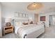 Charming main bedroom with stylish décor, featuring a comfortable bed, side tables, and accent lighting at 10148 Hadley St, Orlando, FL 32829
