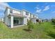 Spacious backyard offers a covered patio, lush lawn, and potential for outdoor enjoyment at 10245 Park Estates Ave, Orlando, FL 32836