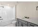 Stylish bathroom with a modern vanity, sleek sink, and a tub with a shower at 10245 Park Estates Ave, Orlando, FL 32836
