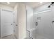 Bathroom featuring a glass-enclosed shower with a built-in bench and modern fixtures at 10245 Park Estates Ave, Orlando, FL 32836