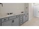 Bathroom vanity with double sinks, stylish fixtures, and plenty of storage space at 10245 Park Estates Ave, Orlando, FL 32836